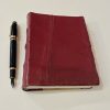 red leatherbound journal